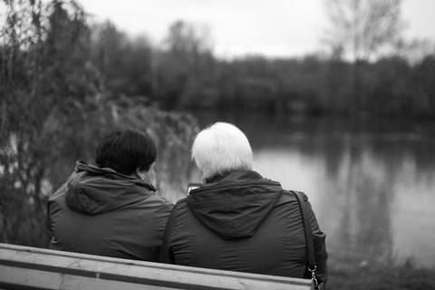 Side by side on the same bench, years apart